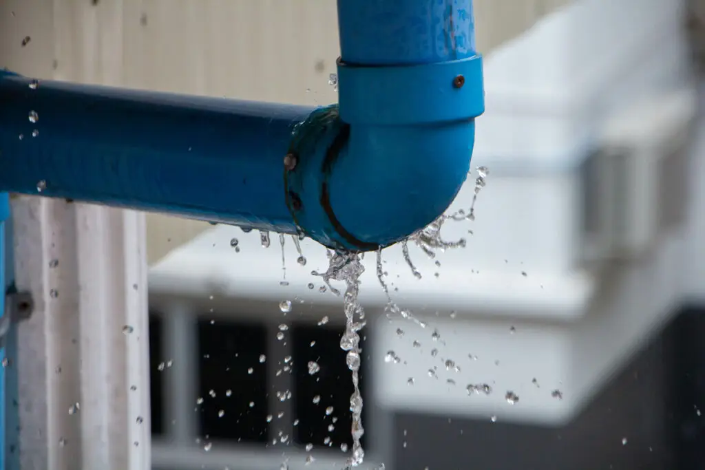 A blue pipe with a water leak in El Paso.