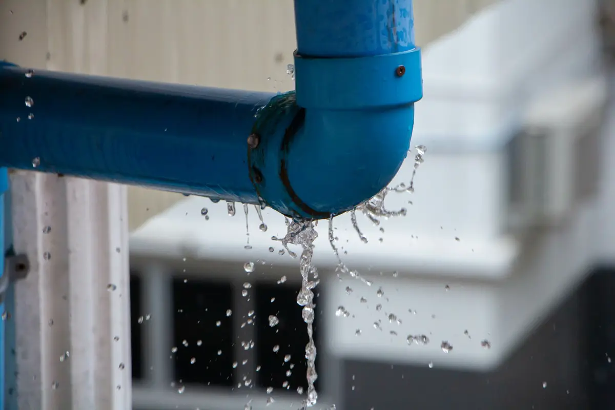 A blue pipe with a water leak in El Paso.